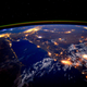 Illustration for article titled The Nile River is a Glowing River of Light Snaking Across a Darkened Planet